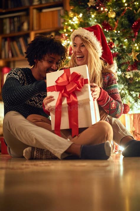 Christmas Presents Couple Exchanging Christmas T Stock Image