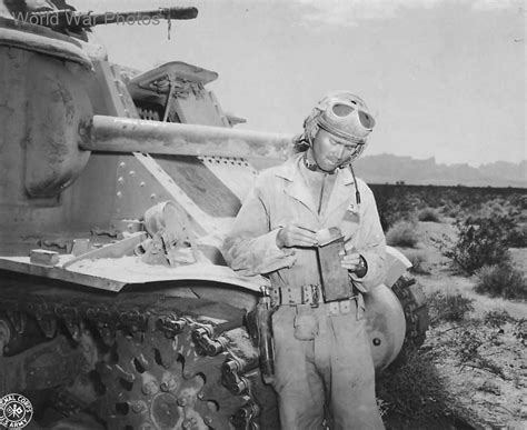 Member Of 3rd Armored Division Tank Crew Opens A Box Of Field Rations