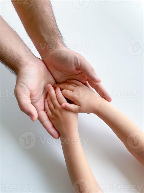 Adult And Child Hold Their Hands Together Fathers Day Child Gives Hand