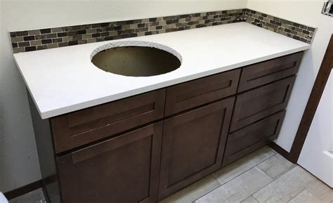 The material is very heavy and needs to be. DIY Quartz Countertops - Bathroom