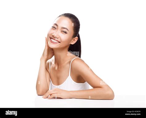 Beauty Portrait Of Smiling Asian Woman With Tanned Clean Skin Isolated