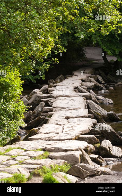 The Prehistoric Clapper Bridge Across The River Barle At Tarr Steps