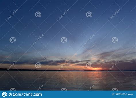 Glowing Sunlight In The Clear Blue Twilight Sky In The Silence Of The