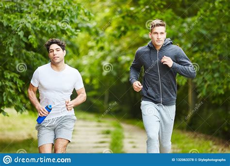 Men Running In The Park Stock Photo Image Of Fitness 132063378