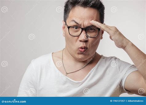 Asian Man In Salute Pose Ready To Fulfill The Order Stock Image