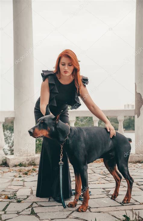 Beautiful Woman Owner With Her Dog Black Doberman Outdoor Walking