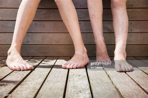 Two Girls Standing Barefoot View Of Legs Photo Getty Images