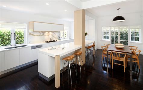 Houzz feature b+g design's designer residence in an exclusive, front page article, highlighting the beneficial ways the island merges with the kitchen table in a seamless & functional manner. Houzz kitchen design award | Art of Kitchens