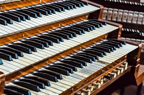 Close Up Of Ancient Pipe Organ Keyboards In European Cathedral Stock