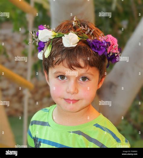 Very Beautiful Boy Crowned With A Wreath Of Flowers Stock Photo Alamy