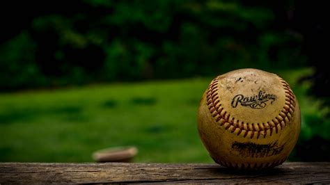 Download Cool Baseball Ball On Wood Surface Wallpaper