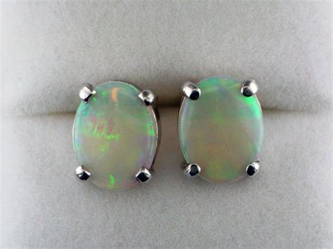 White Oval Opal Earrings In White Gold Available At John Wallick