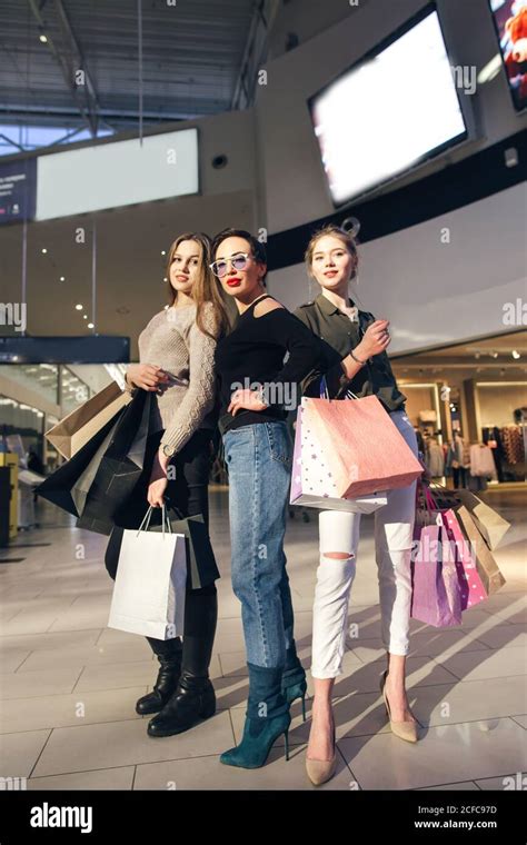 Three Womans Shopping In Mall With Papperbags Stock Photo Alamy