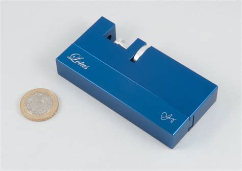 A metal box puzzle called the lotus puzzle where the objective is to find the lotus flower inside. Puzzling Times: Strijbos' Lotus Puzzle