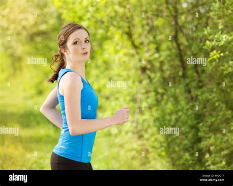 Pretty Young Girl Runner In The Forest Stock Photo Alamy