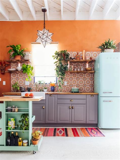 Orange is a difficult color to blend, so better rock it with neutrals, eggplant, bold and dark shades or blue and black or grey, be orange kitchen cabinets with sleek black countertops and chalkboard walls for a family retreat. 10 Best Kitchen Wall Color Trends | Decoholic