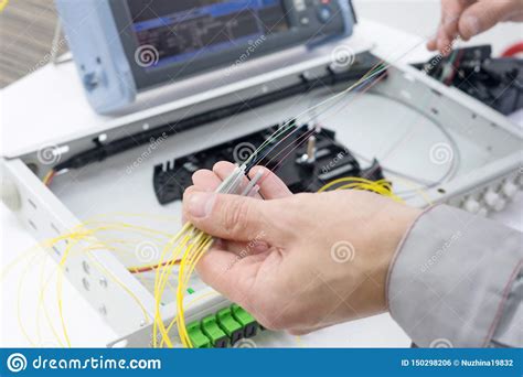 Splicing The Fiber Optic Cable On Spice Tray Stock Photo