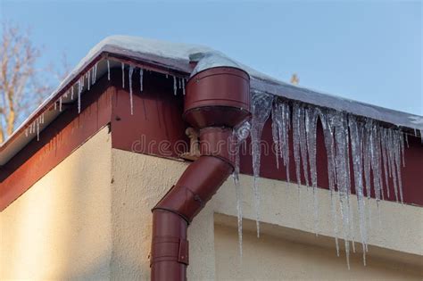Big Icicles On The Roof Of A Townhouse Stock Photo Image Of People