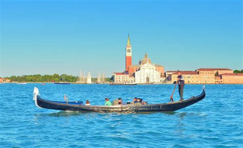 Gondola And The Island Of San Giorgio Maggiore Venice Italy Stock