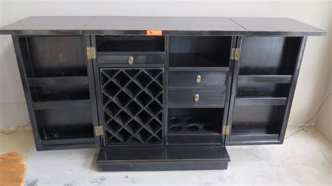 Make the most of any space with the home bar series 21 in. Black Lacquer Fold-Out Bar/Wine Cabinet - 38.5" W X 20" D ...