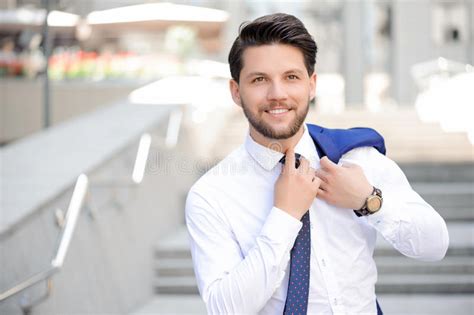 Young Businessman Holding Jacket On Shoulder Stock Photo Image Of