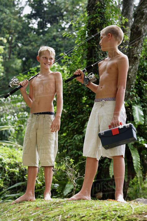 Two Young Boys With Fishing Gear Stock Photo Dissolve
