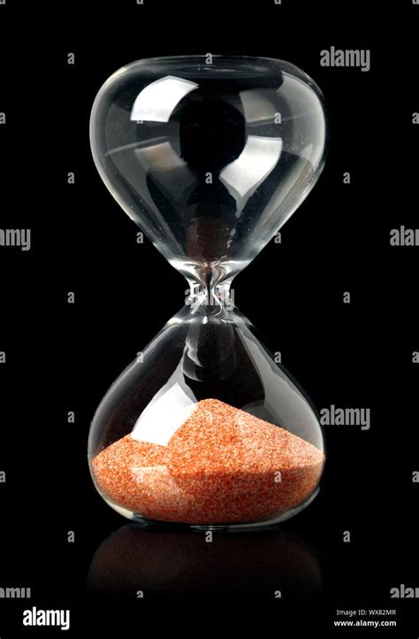 Hourglass With Red Sand Showing The Passage Of Time Stock Photo Alamy