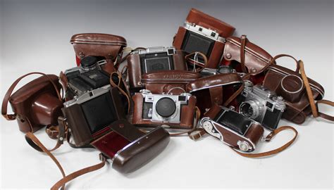 A Collection Of Ten Assorted Cameras Including Two Kiev 4 Type 4