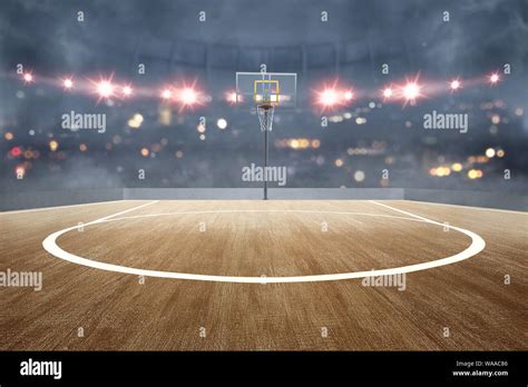 Basketball Court With Wooden Floor And Spotlights Over Blurred Lights