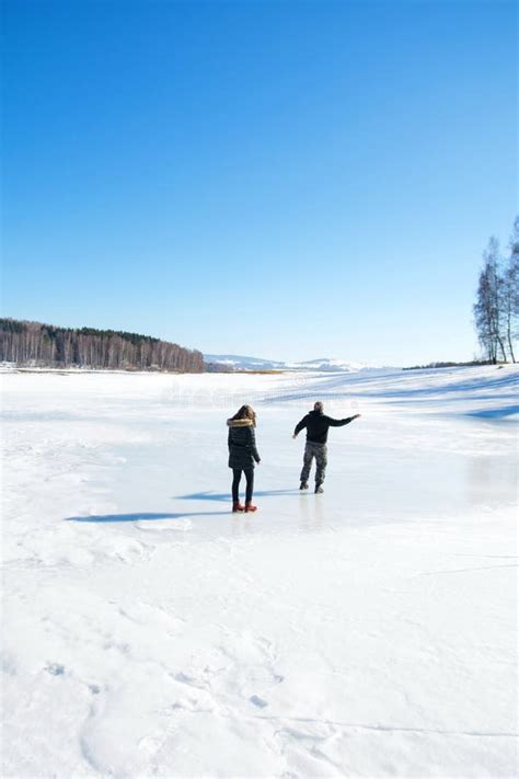 Couple Skating On The Frozen Lake Stock Image Image Of Leisure