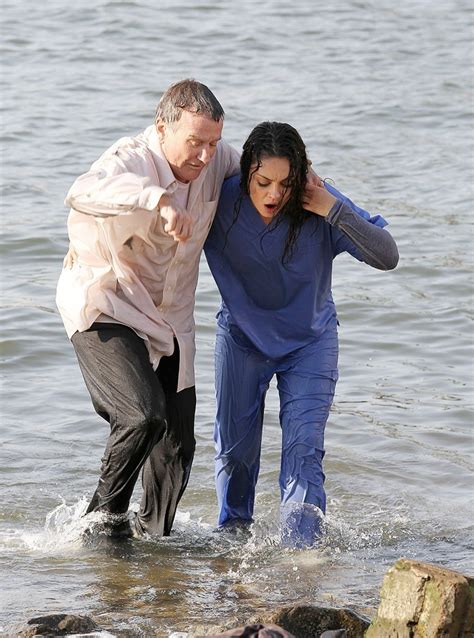 robin williams photos photos actors mila kunis and robin williams seen getting soaking wet in