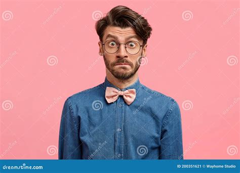 Indoor Shot Of Surprised Unshaven Man With Trendy Hairstyle Stupefied