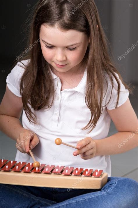 Cute Dark Haired Girl Playing Xylophone Stock Photo By ©lieself 30342103