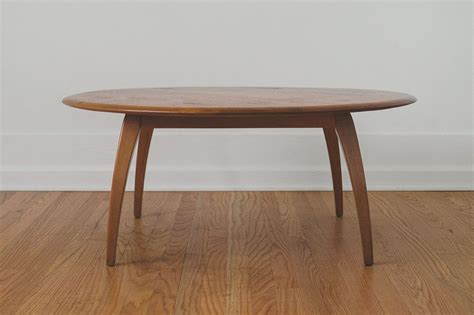 This is a mid century modern round coffee table by heywood wakefield, with a revolving top and their signature arched spider legs. Heywood Wakefield Coffee Table | Coffee table, Table ...