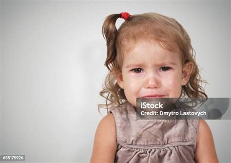 Portrait Of Crying Baby Girl With Copyspace Stock Photo Download