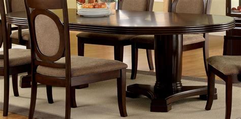 The table extends by sliding out the two. Evelyn Walnut Oval Extendable Pedestal Dining Table from ...