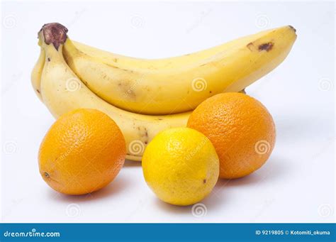 Bananas A Lemon And Two Oranges Royalty Free Stock Photo Image 9219805