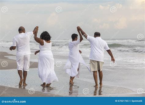 Happy Senior African American Couples Men Women On Beach Stock Image