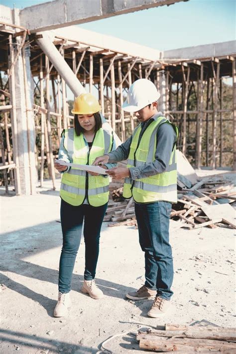 Two Specialists Inspect Commercial Industrial Building Construction
