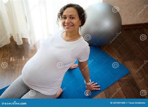 Close Up Portrait Smiling Pregnant Woman Sitting In Hero Pose On A Yoga