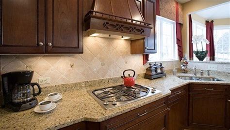 As far as granites go, venetian gold is on the affordable side. new venetian gold granite dark cabinets tile backsplash ...