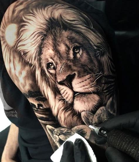 The open mouth feature looks extra real, especially once the tattoo artist adds in pink ink to the tongue. Lion Clock Cross Tattoo - Tattoos Gallery