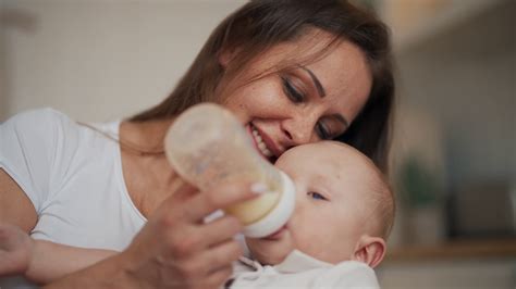 Mom Feeding Baby Using Bottle With Milk Mix Stock Footage Sbv 348671836