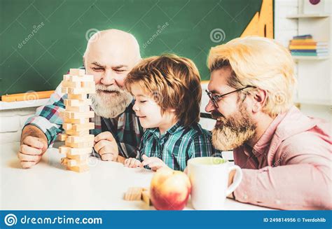 Grandfather Father And Son Playing Indoors Grandfather Father And