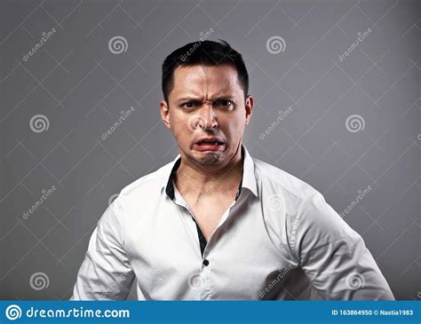 Pout Grimacing Angry Business Man Looking Aggressive On Grey Background