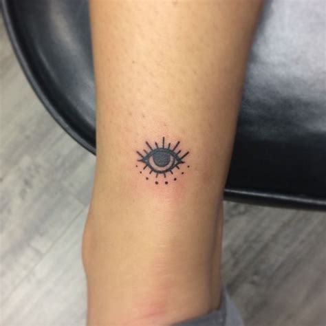 15 tiny evil eye tattoo ideas to ward off misfortune in 2020 evil eye tattoo hand tattoos