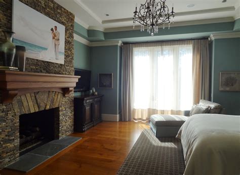 Maybe you would like to learn more about one of these? The fireplace and mantle are a nice touch in this master ...