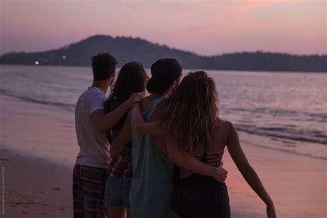 Group Of Friends Watching Sunset Together On The Beach By Jovo Jovanovic
