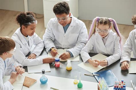 Children Doing Experiments During Science Class In School Stock Image