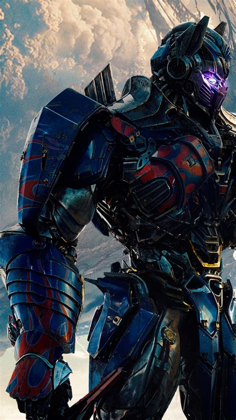 The last knight showed us the shocking moment of optimus prime fighting bumblebee. Download 1080x1920 Transformers: The Last Knight, Optimus ...